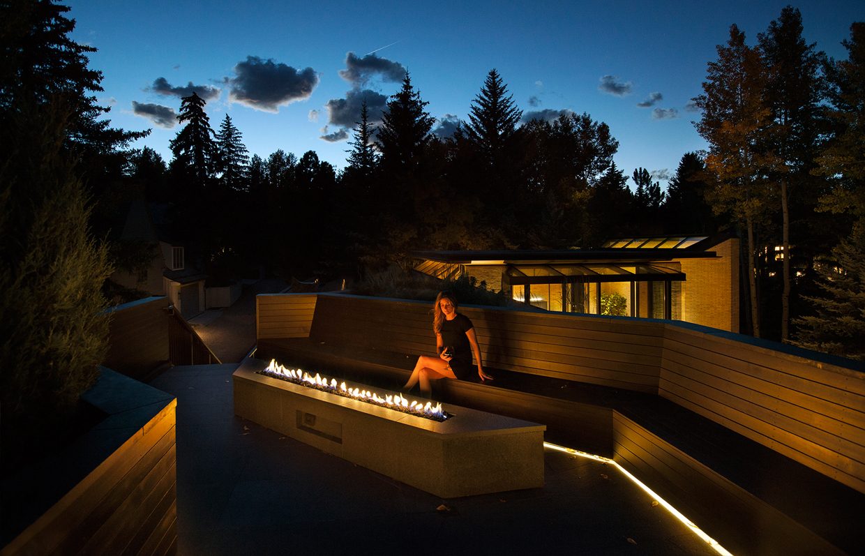 Rooftop terrace with fire pit at dusk